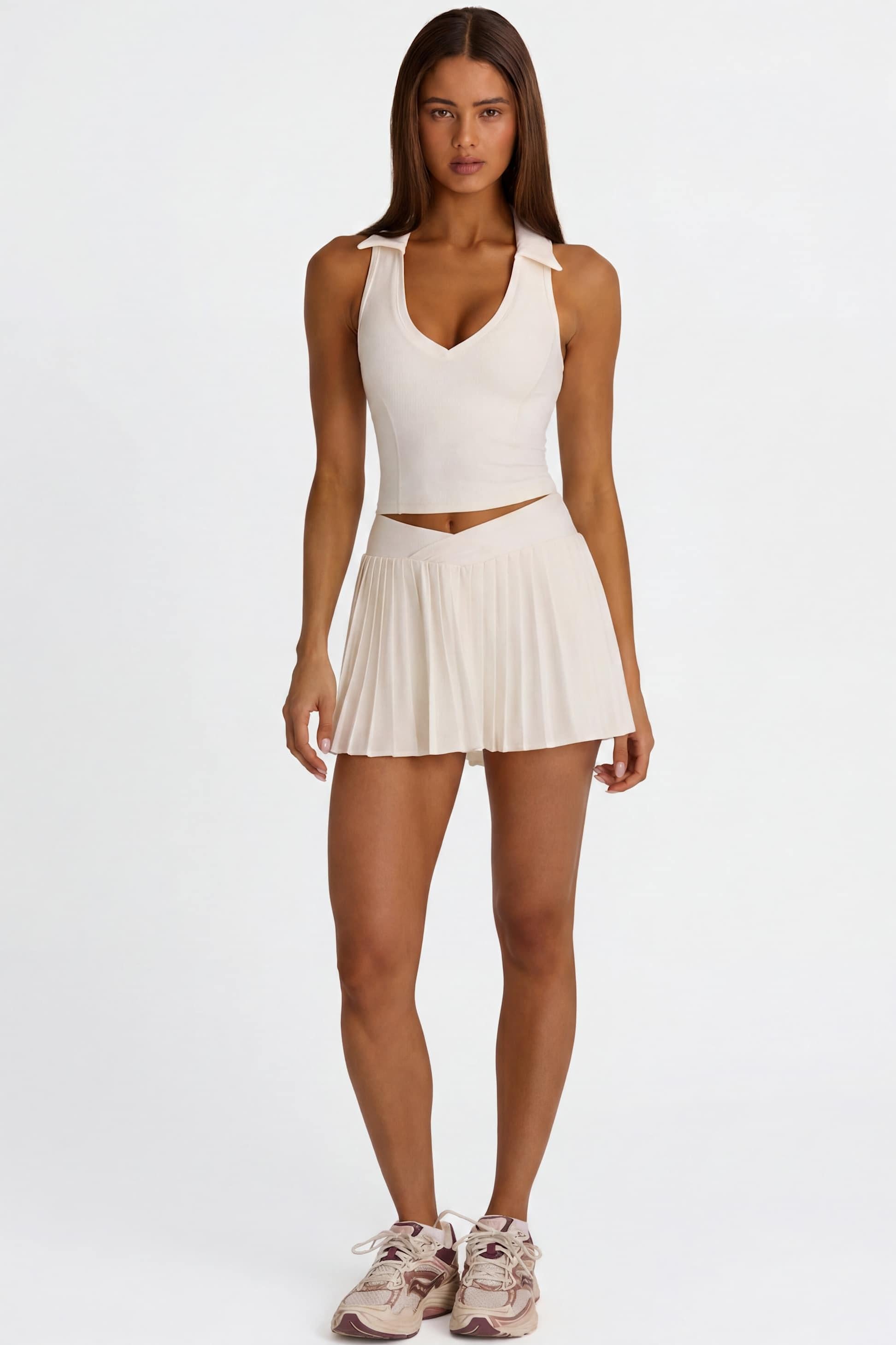 Soft Active Crossover Pleated Mini Skort In Coconut